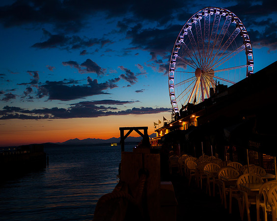 Ferris wheel on the water at sunset